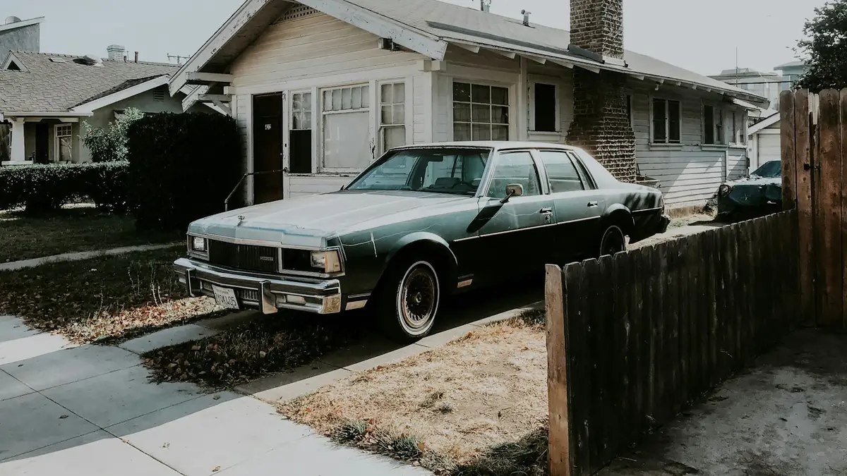 Craftsman bungalow with a classic sedan parked in the driveway - Water Heater Repair in Whittier